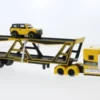 Maisto International Autotransporter, gelb/schwarz, 1:64, Hot