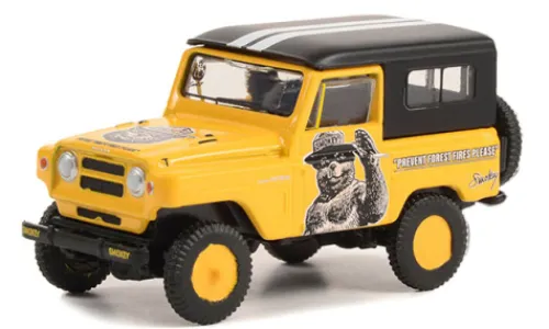Greenlight Nissan Patrol, gelb/schwarz, 1965, Smokey Bear, 1:64, Outlet